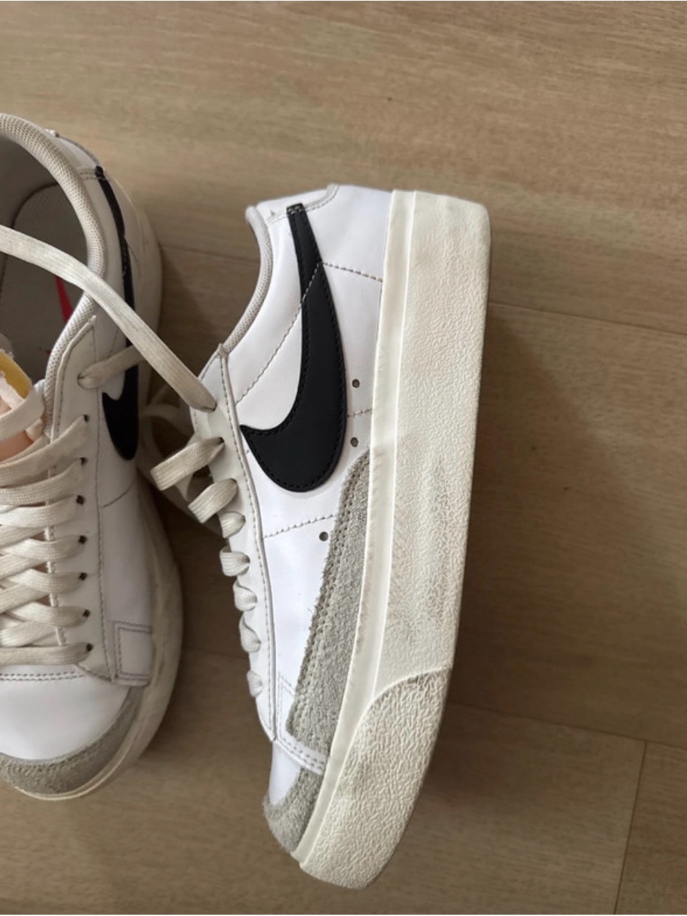Nike Women's White Sneakers with Black Swoosh